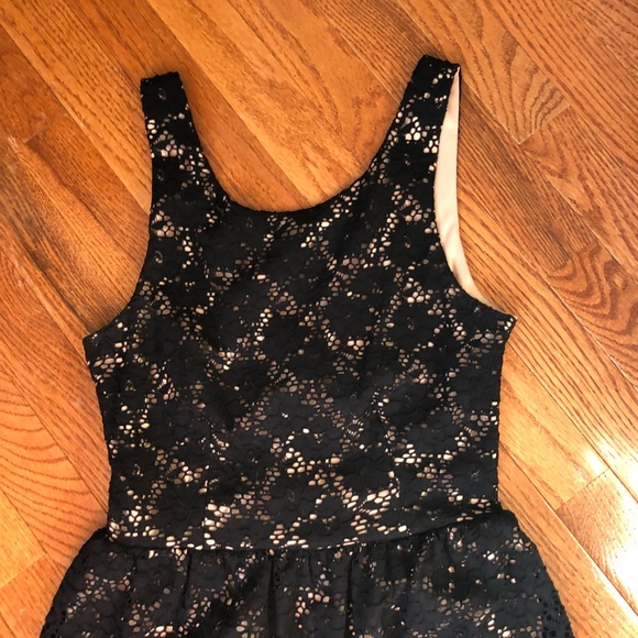 Black lace skater dress with a tan under skirt - Picture 2 of 4
